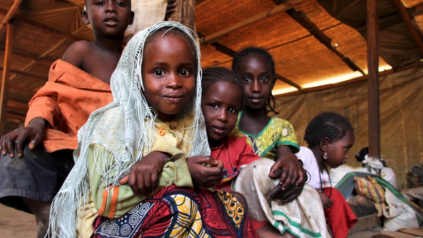 "Gara Boulai, eastern Cameroon, 16 April 2015: Children at the transit camp in Gara Boulai. Their families have come to register as refugees. Many have already spent several months in Cameroon staying in the bush or with host families, but now need assistance. Credit: OCHA/Ivo Brandau"
